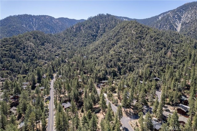 mountain view with a wooded view