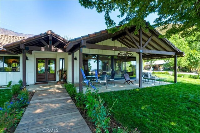37547 Oak Glen Rd, Oak Glen, CA 92399 - doorway to property featuring french doors, a tile roof, and a yard