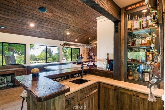 37547 Oak Glen Rd, Oak Glen, CA 92399 - bar featuring wooden ceiling, wood finished floors, recessed lighting, indoor wet bar, and a sink
