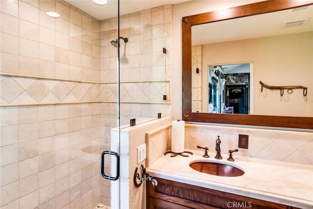 37547 Oak Glen Rd, Oak Glen, CA 92399 - full bath with visible vents, a stall shower, backsplash, and vanity