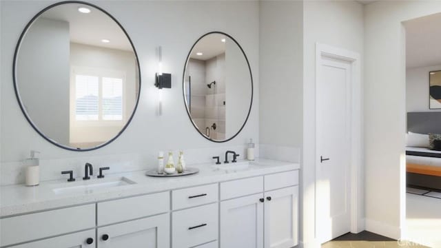 full bathroom with recessed lighting, tiled shower, double vanity, and a sink