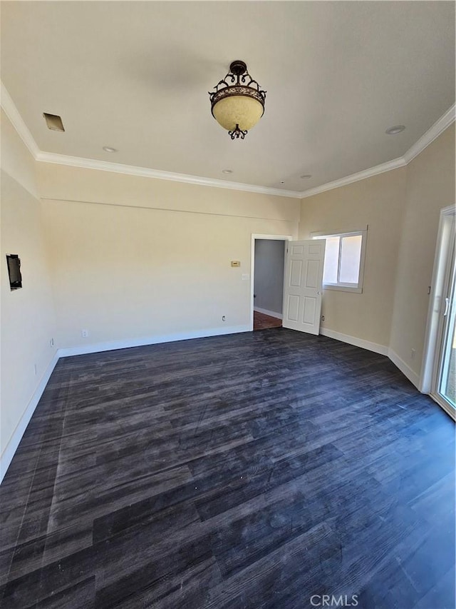unfurnished room featuring ornamental molding, dark wood-style floors, and baseboards