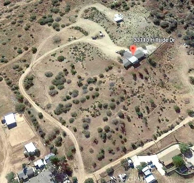 birds eye view of property with a rural view and a desert view