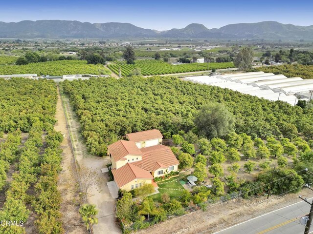 aerial view featuring a mountain view and a rural view