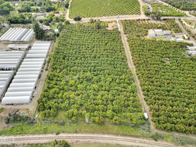 birds eye view of property with a rural view