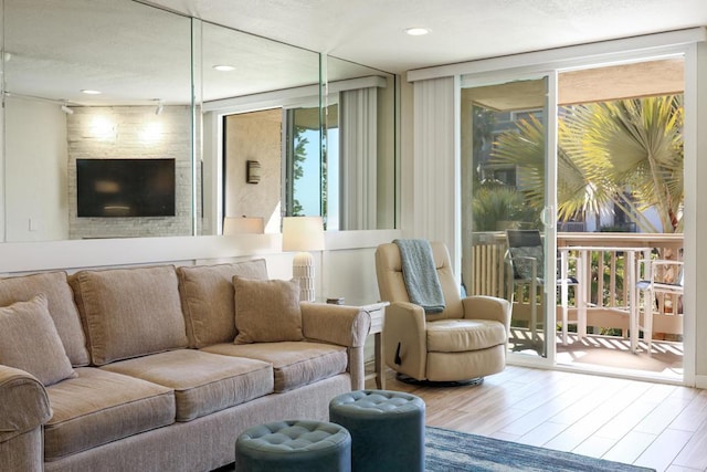 999 N Pacific St Unit E108, Oceanside, CA 92054 - interior space with recessed lighting, wood finished floors, and a wall of windows