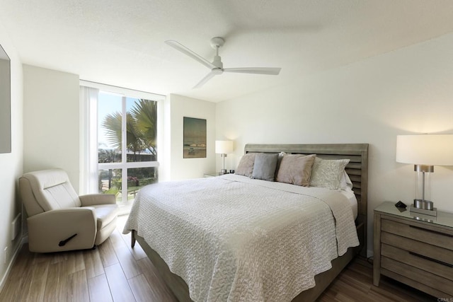 999 N Pacific St Unit E108, Oceanside, CA 92054 - bedroom with a ceiling fan and wood finished floors
