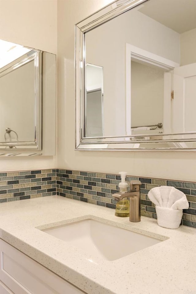 999 N Pacific St Unit E108, Oceanside, CA 92054 - bathroom featuring vanity and backsplash
