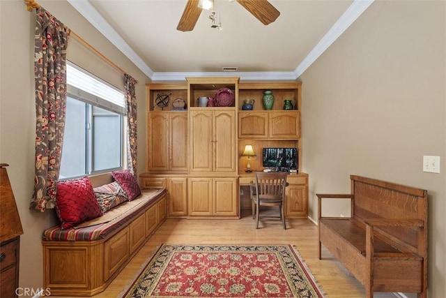 office featuring visible vents, ceiling fan, crown molding, and light wood finished floors