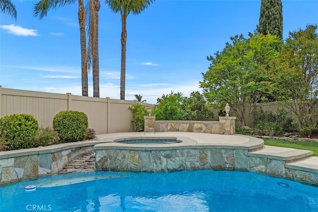 view of swimming pool featuring a fenced in pool, an in ground hot tub, and fence