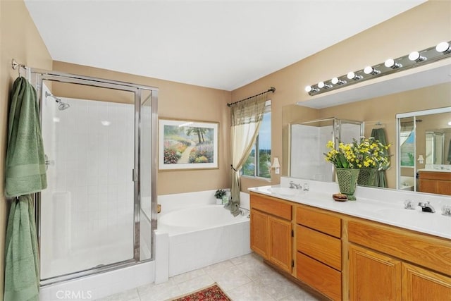 full bathroom with tile patterned floors, a shower stall, double vanity, a sink, and a garden tub
