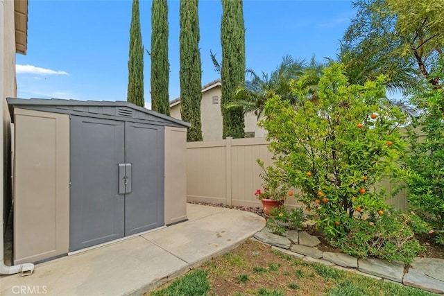 view of shed with fence