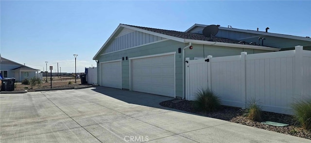 view of side of home featuring fence and board and batten siding