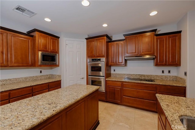29515 Longhorn Dr, Canyon Lake, CA 92587 - kitchen featuring stainless steel appliances, under cabinet range hood, light stone countertops, recessed lighting, and light tile patterned flooring