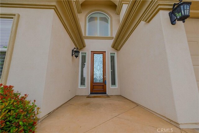 29515 Longhorn Dr, Canyon Lake, CA 92587 - view of exterior entry with stucco siding and a patio area