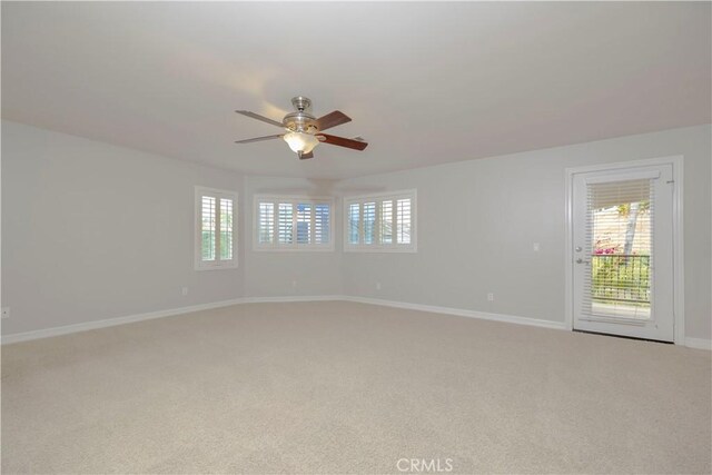 29515 Longhorn Dr, Canyon Lake, CA 92587 - spare room featuring light carpet, a ceiling fan, and baseboards