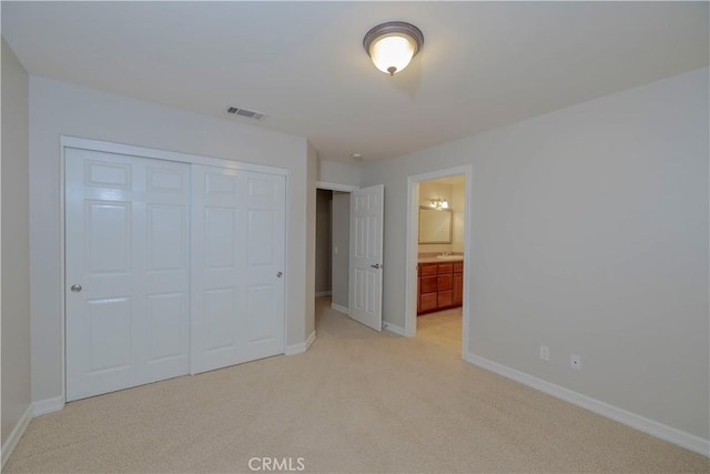 29515 Longhorn Dr, Canyon Lake, CA 92587 - unfurnished bedroom with light carpet, a closet, baseboards, and ensuite bath
