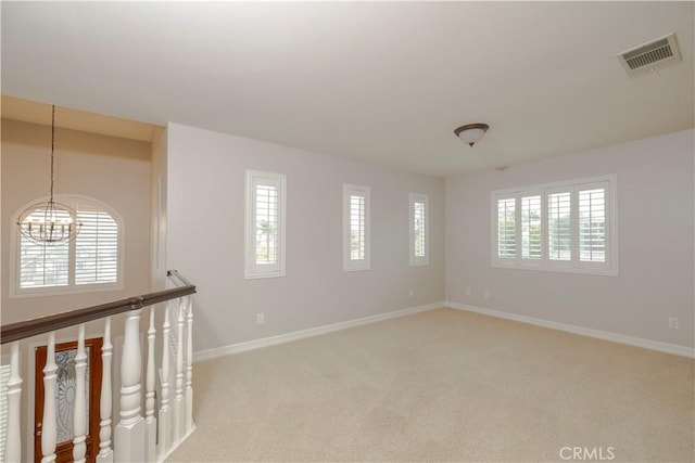 29515 Longhorn Dr, Canyon Lake, CA 92587 - spare room featuring plenty of natural light, a chandelier, light colored carpet, and baseboards