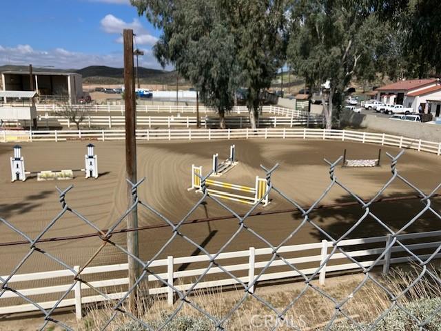 29515 Longhorn Dr, Canyon Lake, CA 92587 - gate featuring fence and an enclosed horse arena
