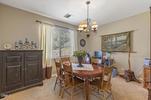 dining space with light colored carpet, a chandelier, baseboards, and visible vents