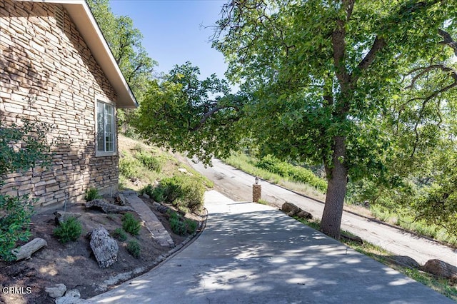 view of road with driveway
