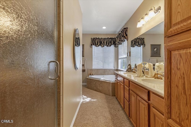 full bath featuring a sink, baseboards, a stall shower, double vanity, and a garden tub