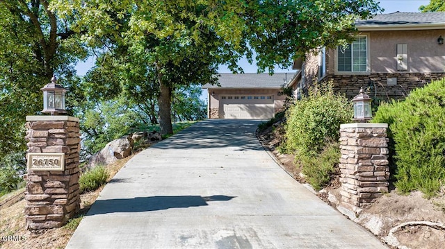exterior space featuring concrete driveway