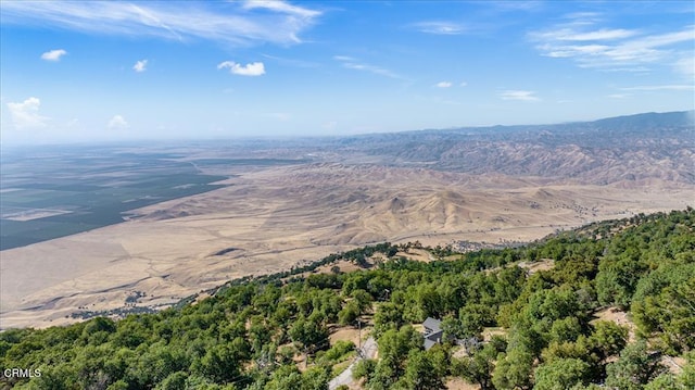 bird's eye view with a forest view and a mountain view