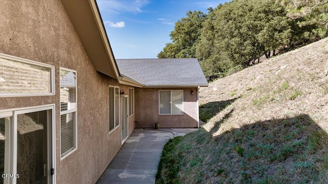 view of home's exterior with stucco siding