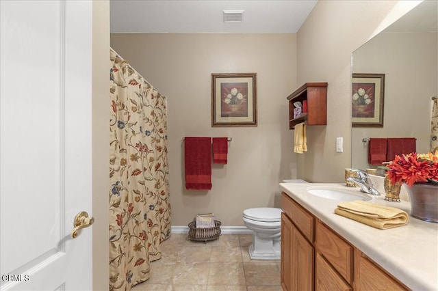 bathroom with toilet, vanity, visible vents, tile patterned flooring, and baseboards