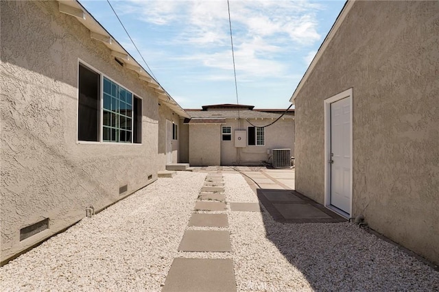 view of yard with cooling unit and a patio area