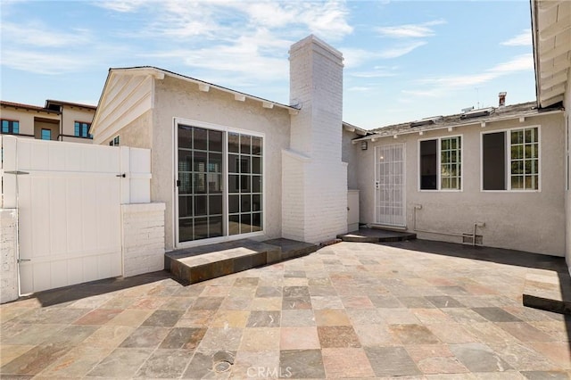 view of patio / terrace with fence and a gate
