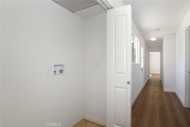 hall featuring wood finished floors and baseboards