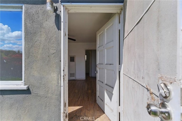 doorway to property featuring stucco siding