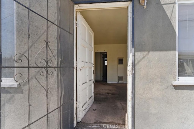 property entrance featuring stucco siding