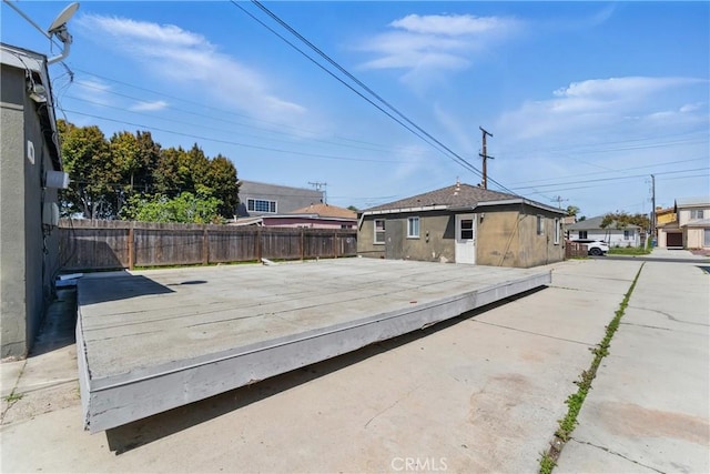 deck featuring fence and a patio