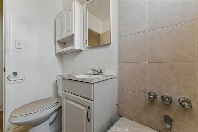 bathroom with toilet, walk in shower, and vanity