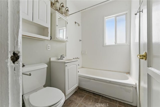 full bath with a tub to relax in, toilet, tile patterned flooring, and vanity