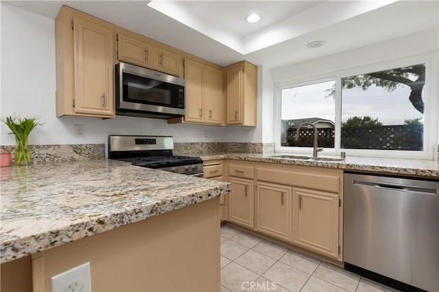 983 Elsa Ct Unit D, Corona, CA 92881 - kitchen featuring appliances with stainless steel finishes, light stone countertops, a sink, recessed lighting, and light tile patterned flooring