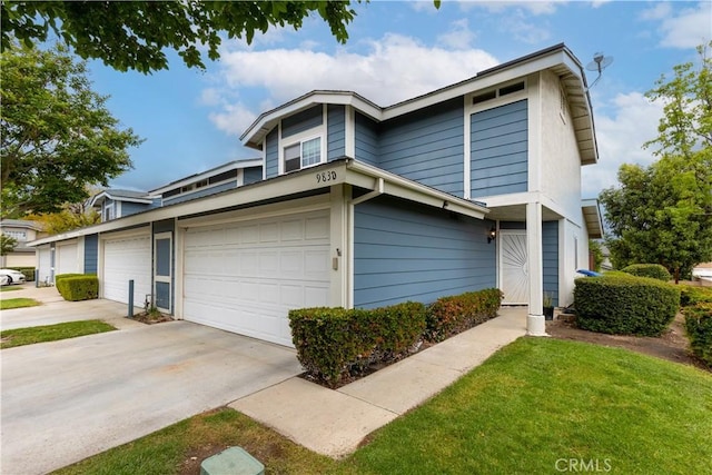 983 Elsa Ct Unit D, Corona, CA 92881 - view of front facade featuring an attached garage and concrete driveway