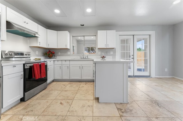 kitchen featuring white cabinetry, a sink, stainless steel electric stove, light countertops, and under cabinet range hood
