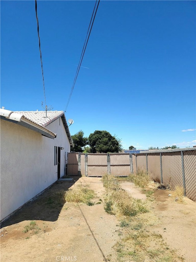 view of yard featuring a gate and fence