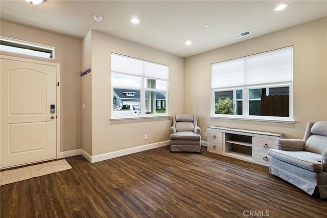 foyer with baseboards, recessed lighting, wood finished floors, and a wealth of natural light