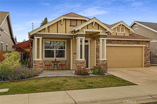 craftsman-style house featuring a front lawn, stone siding, a garage, a porch, and concrete driveway