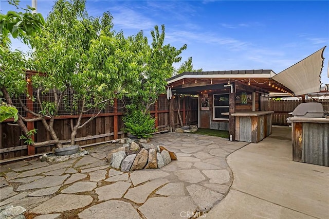 view of patio featuring a gazebo and a fenced backyard