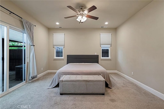 bedroom featuring carpet floors, baseboards, access to exterior, and visible vents