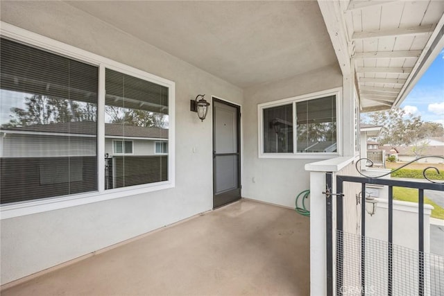entrance to property featuring stucco siding