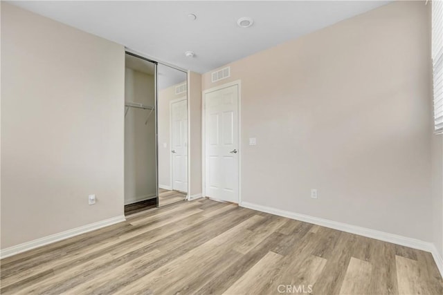9126 Foster Ln, Chatsworth, CA 91311 - unfurnished bedroom featuring light wood-type flooring, baseboards, and a closet