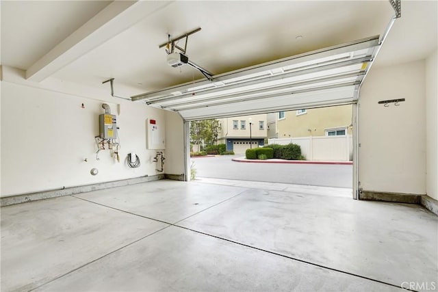 9126 Foster Ln, Chatsworth, CA 91311 - garage with a garage door opener, electric water heater, and water heater