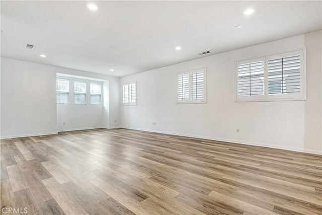 9126 Foster Ln, Chatsworth, CA 91311 - empty room with light wood-style floors, recessed lighting, and baseboards
